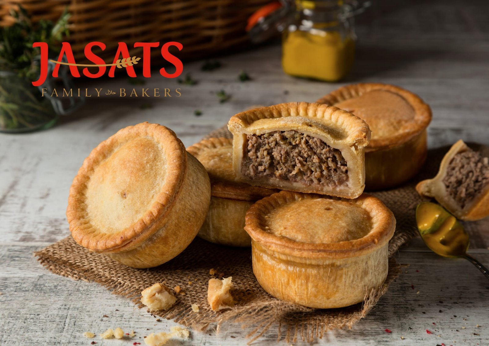 Jasats halal pies arranged around a cut open pie